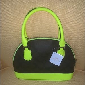 NWT  Signature Coach purse with shoulder strap.